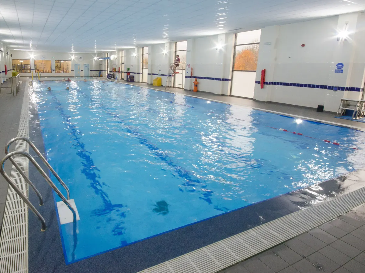 The main swimming pool at Dronfield Active, with a lifeguard on the poolside chair.