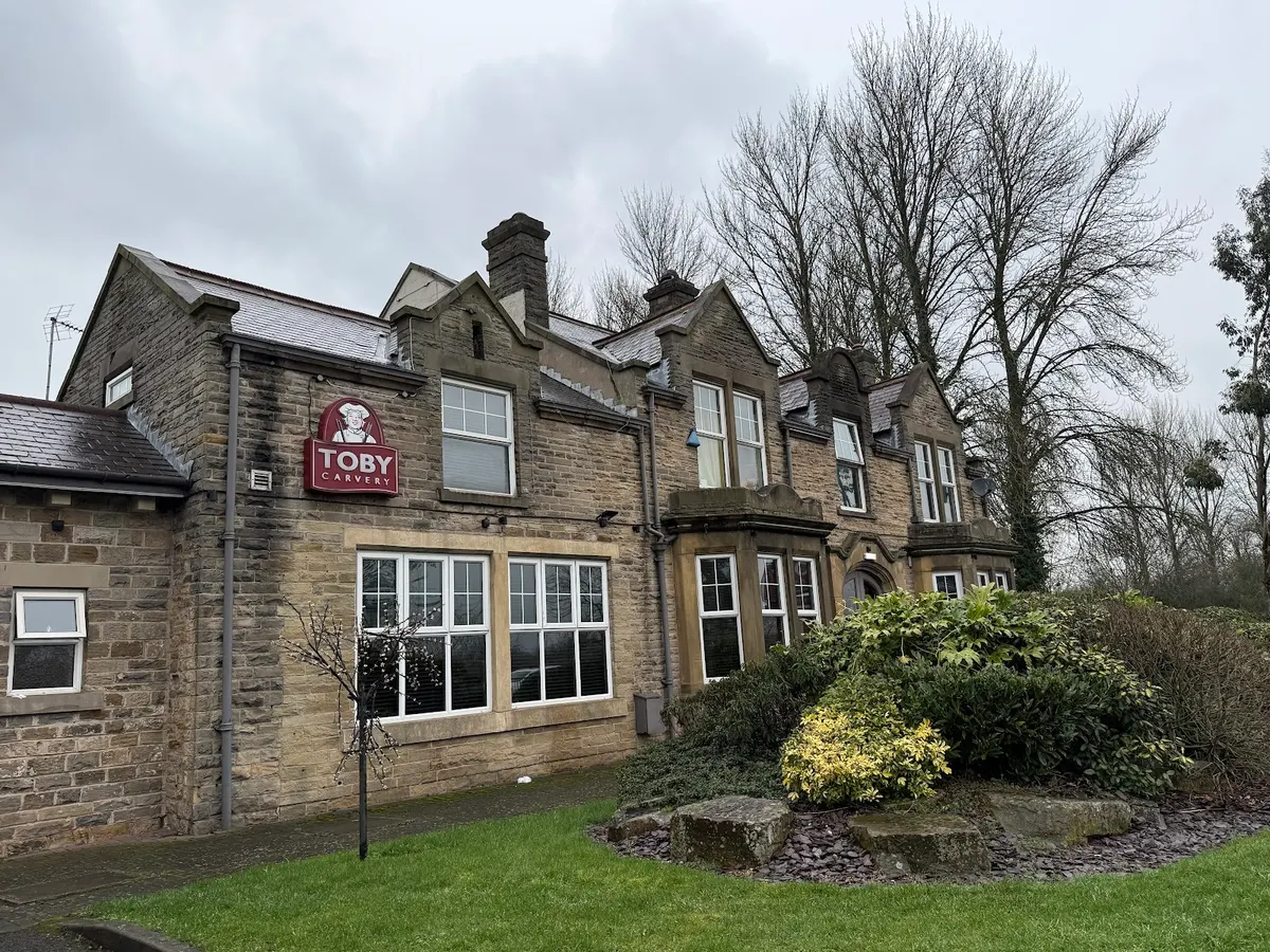 The exterior of Toby Carvery showing a stone building with 'Toby Carvery' sign visible on the front.