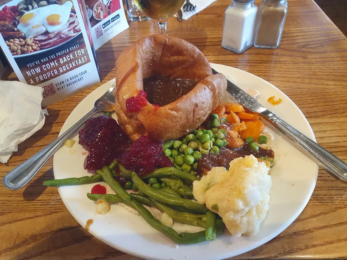 A plated roast dinner with Yorkshire pudding, meat, vegetables and gravy at Toby Carvery.